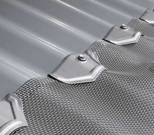 Gutter Guard King Tas Gutter Guard A close up of a metal roof with a mesh covering