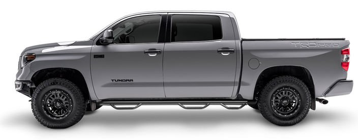 Gray Toyota Tundra pickup truck with black wheels and step bars.