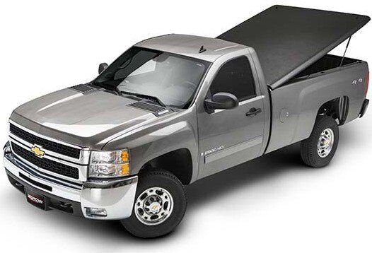 Silver pickup truck with a black solid under cover open.