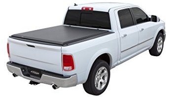 White pickup truck with a black tonneau cover.