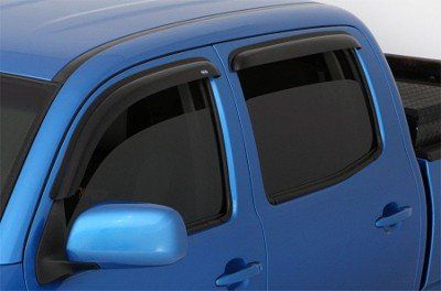 Blue pickup truck with dark window visors.