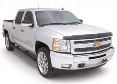 Silver Chevrolet pickup truck with black step bars and chrome accents.