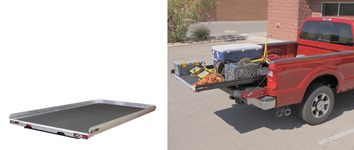A truck bed cargo glide is extended from a red truck, loaded with items like a cooler, toolboxes, and crates.