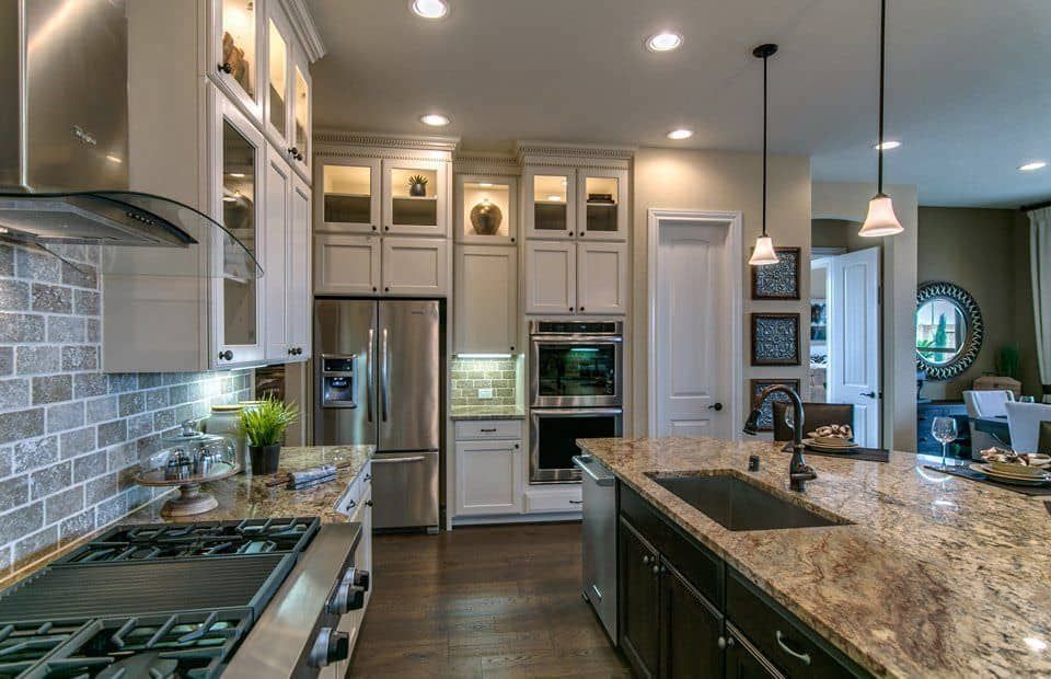 A kitchen with stainless steel appliances and granite counter tops