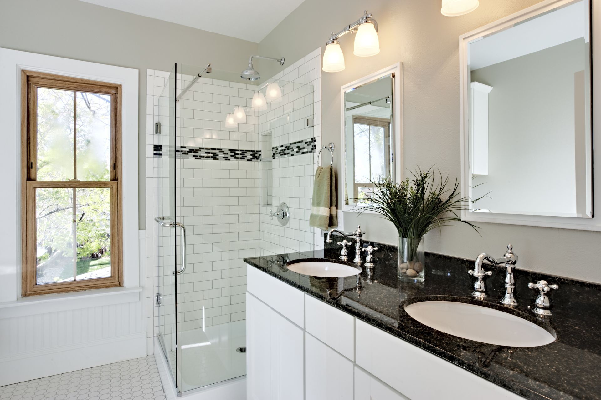 Glass shower and granite counters.