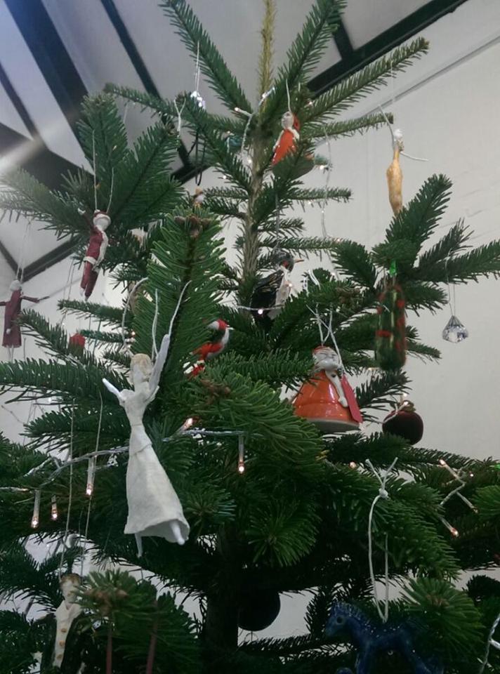 Christmas tree decorated with ornaments and lights.