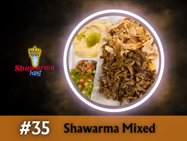 A plate of shawarma mixed with hummus and vegetables.