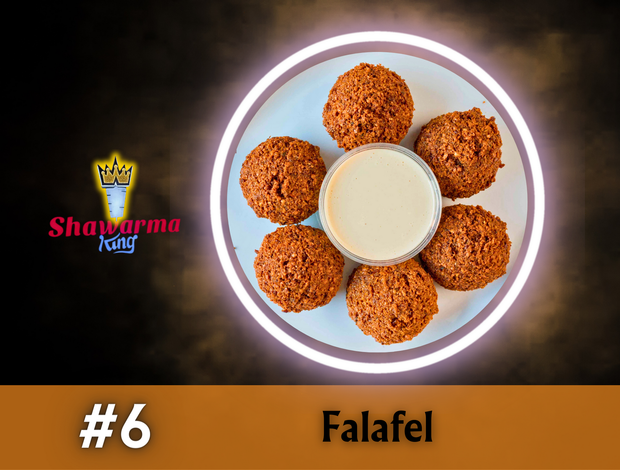 A plate of falafel with a dipping sauce from shawarma king
