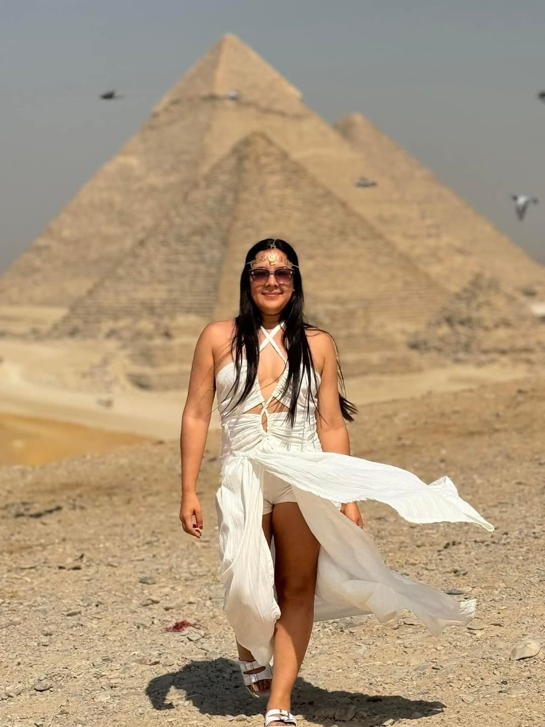 Female traveler enjoying the Pyramids of Giza