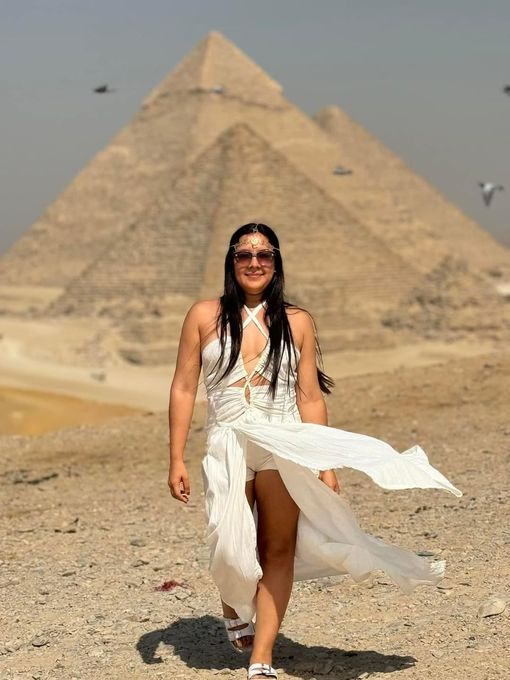 Female traveler enjoying the Pyramids of Giza