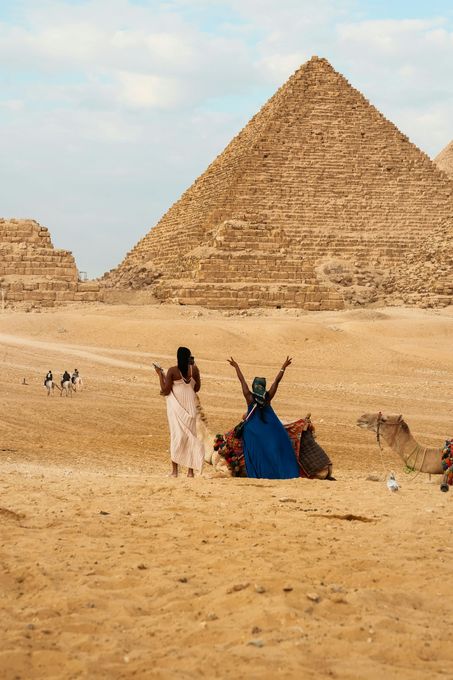 Travelers enjoying panoramic views of the Great Pyramid