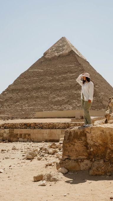 Traveler standing beside the Great Pyramid of Giza
