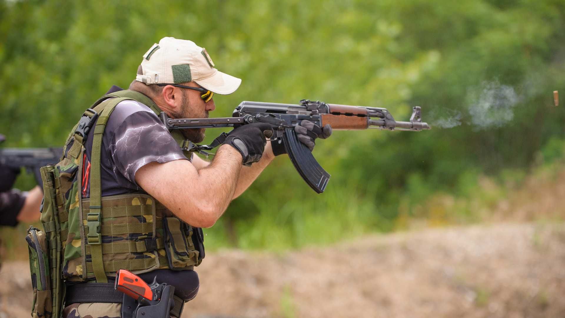 man shooting a rifle