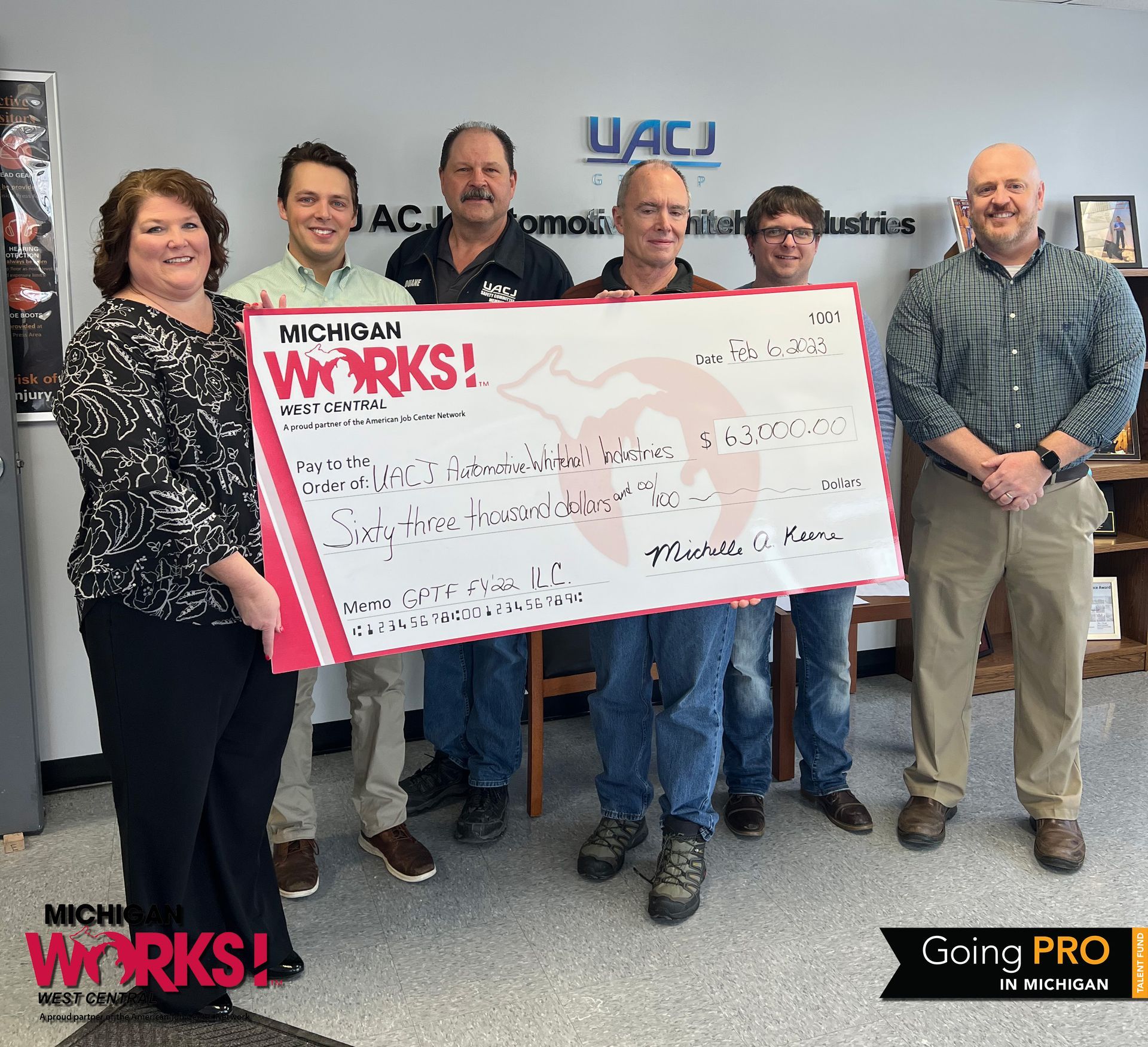 Michigan Works! West Central Executive Director Shelly Keene (left) presents a check to UACJ Automotive-Whitehall Industries for completing its FY22 Going PRO Talent Fund training plan. Pictured from left to right are Keene, Alex Richert, Duane Tyndall, David Cooper and David Holden