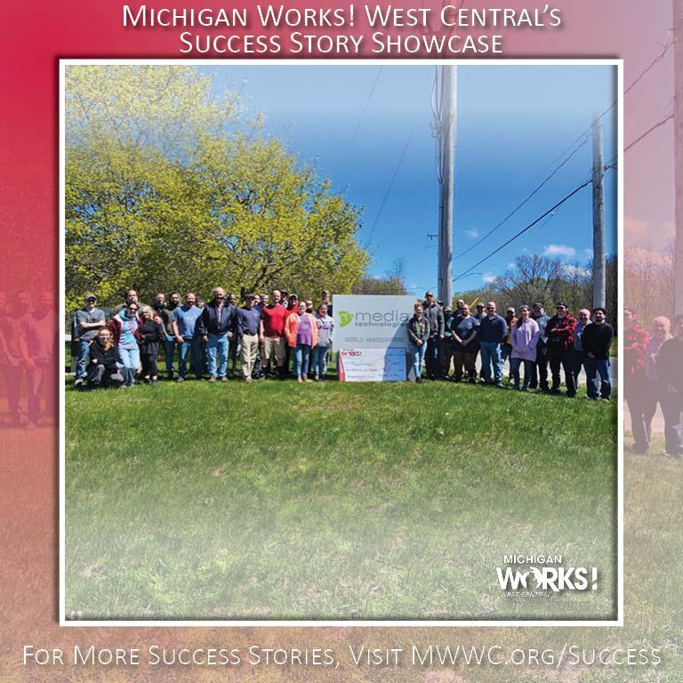 Group posing outdoors by a Michigan Works! sign under a blue sky, with “Success Story Showcase” text.