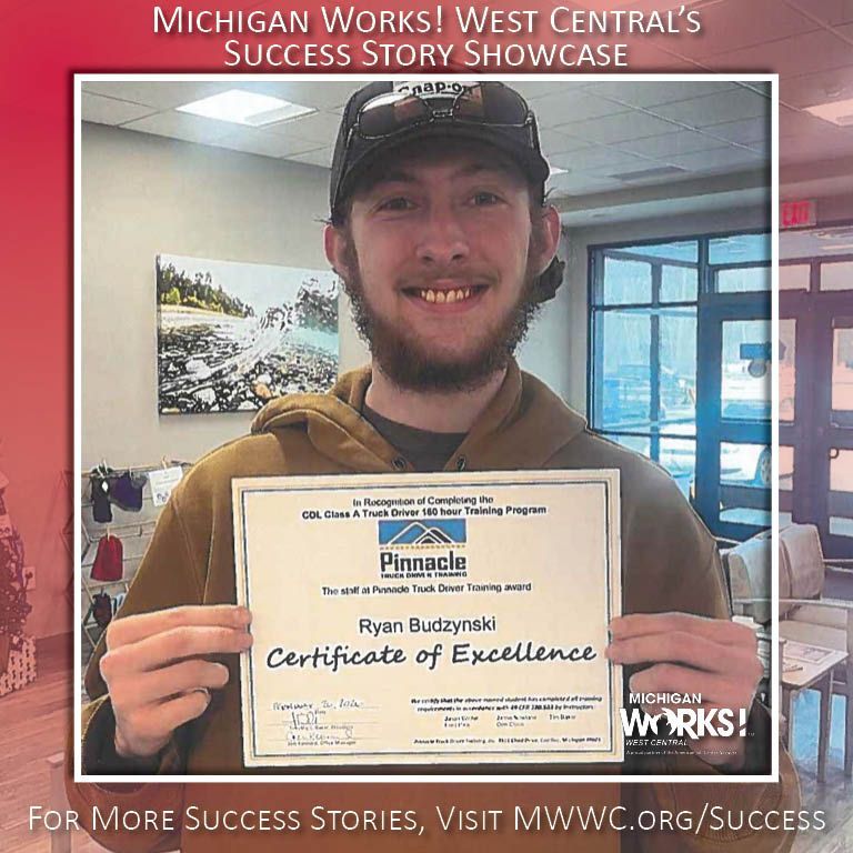 Man holding a certificate and smiling in a Michigan Works! success story showcase photo.