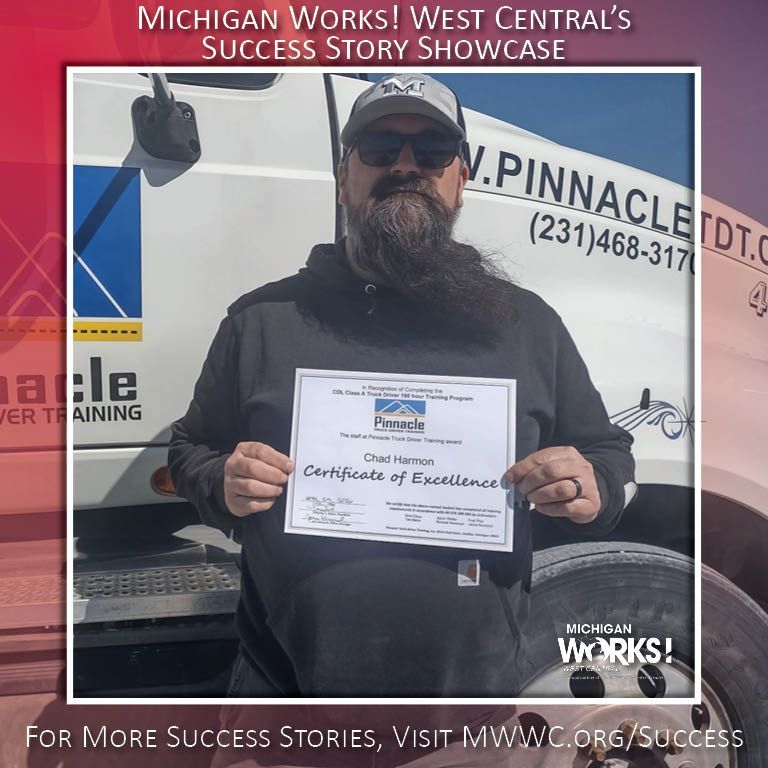 Man holding a certificate in front of a Pinnacle truck, with “Michigan Works!” success story banner above.