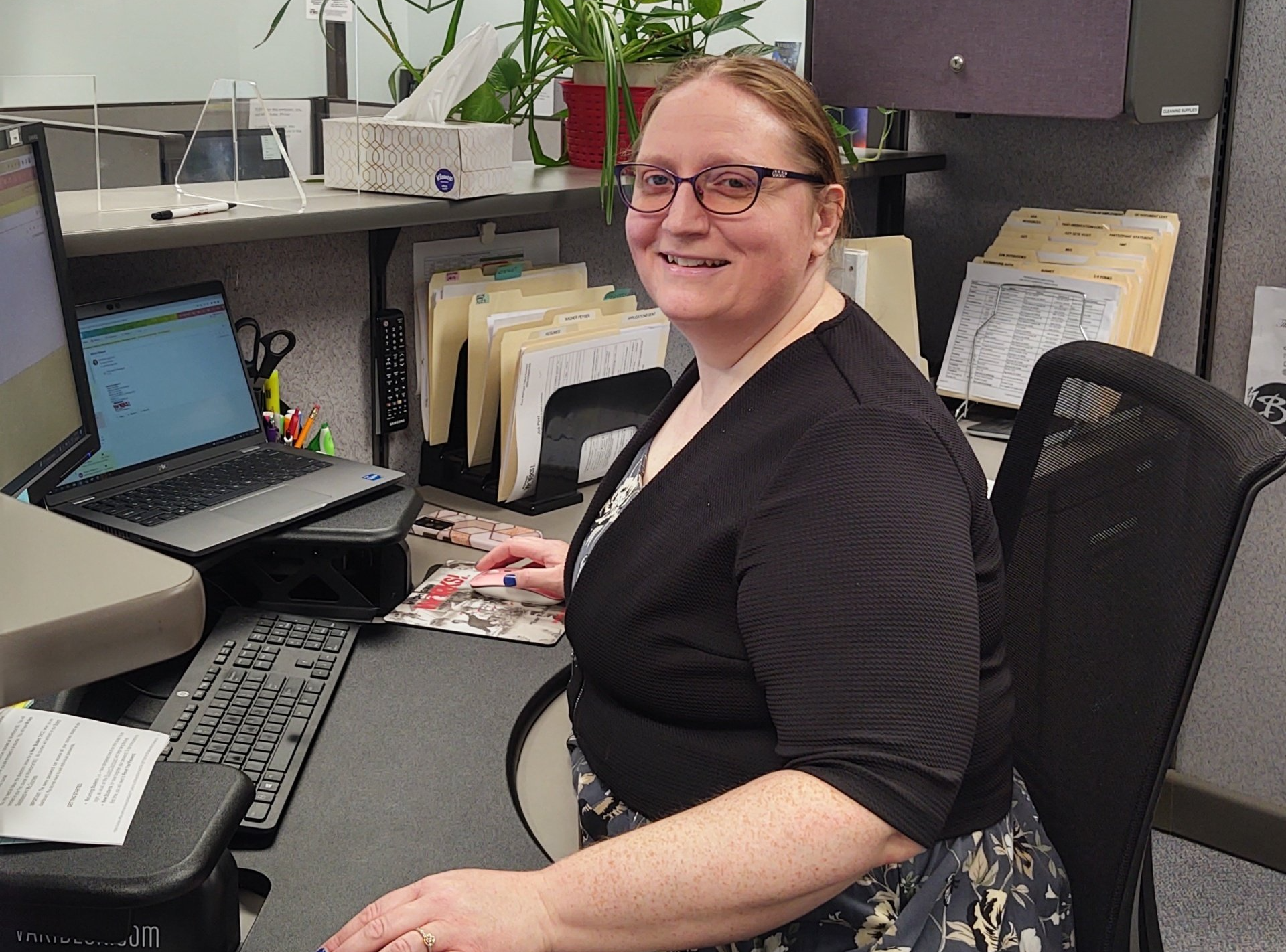 Vanessa Wolgamott sits at her desk.