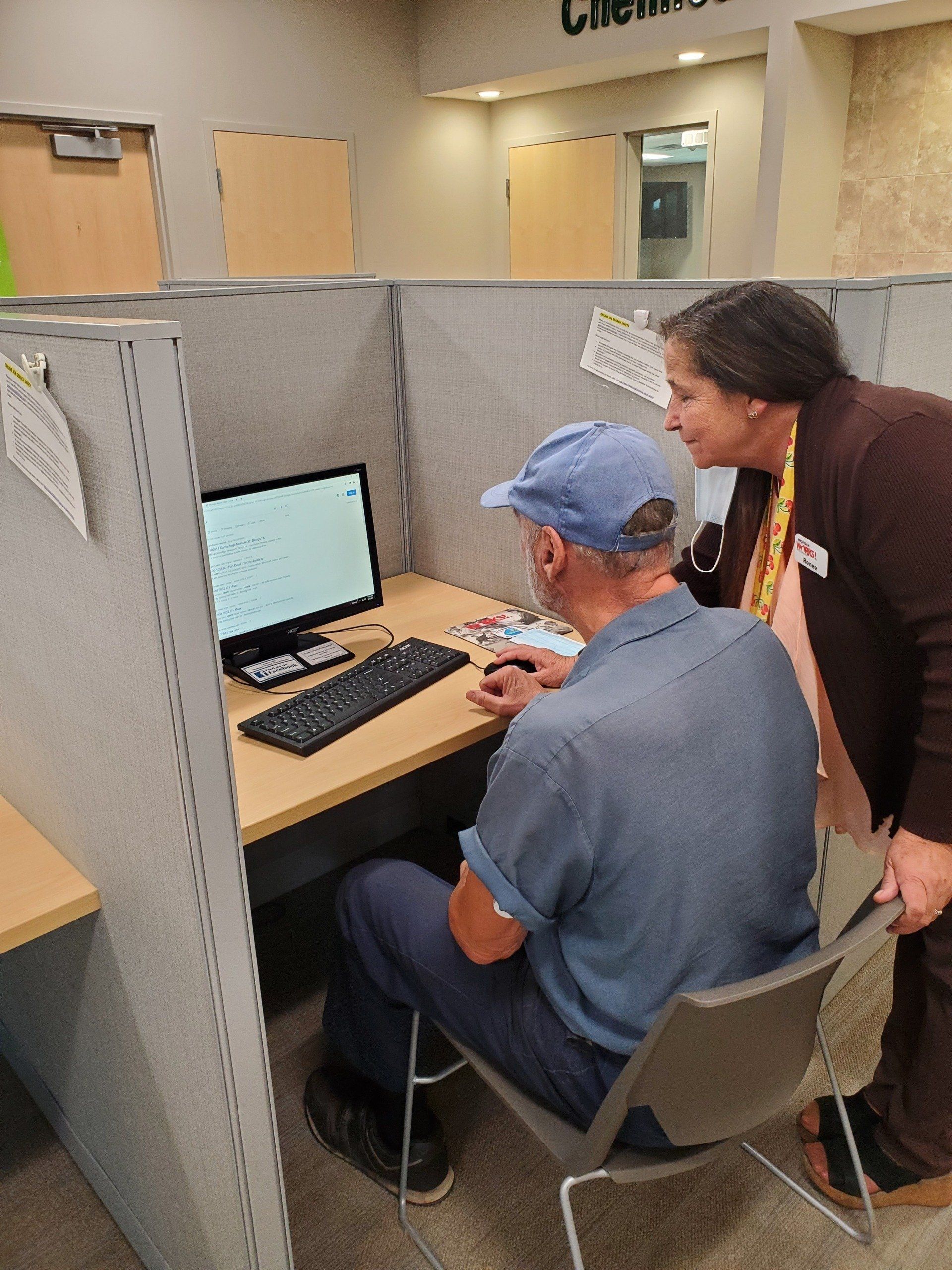 Renee Pickard helps a client at Michigan Works! West Central.