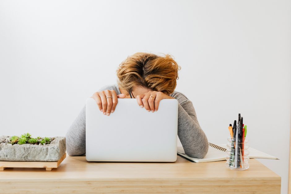 Tired woman at work, a sign of anemia from heavy periods caused by fibroids, Hommage Women's Clinic, Gangnam, Seoul