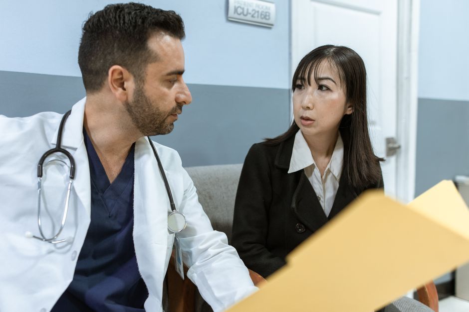 Doctor explaining an ovarian cyst ultrasound report to a woman at Hommage Women's Clinic, Gangnam, Seoul