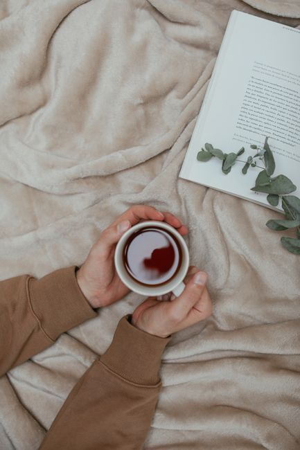 Resting at home with a warm drink during labiaplasty recovery, aftercare guide from Hommage Women's Clinic, Gangnam, Seoul