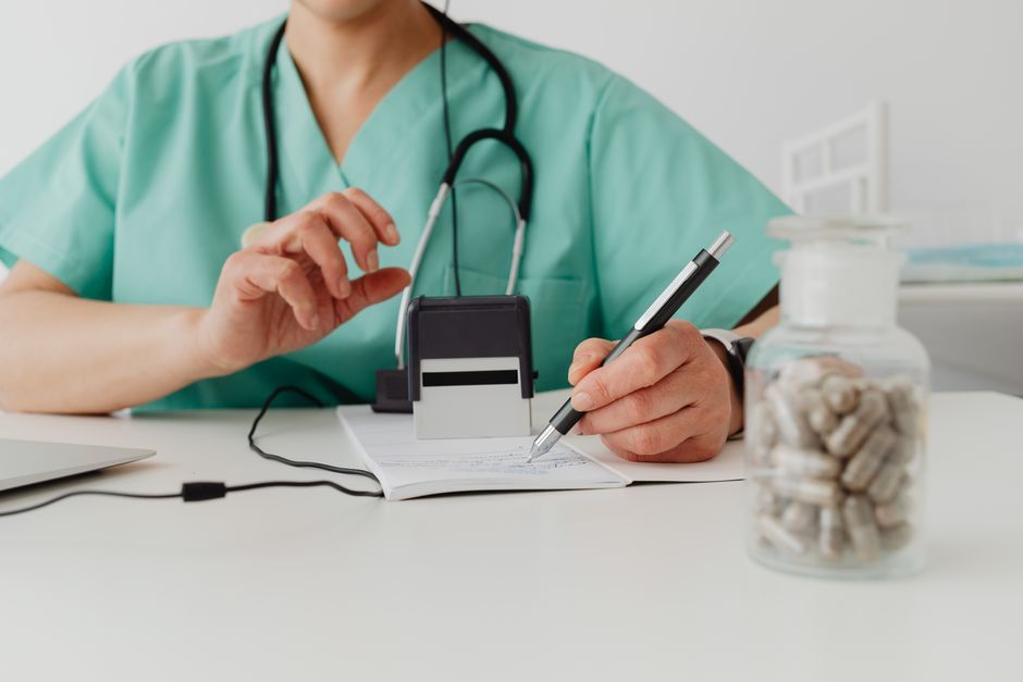 Doctor writing a prescription for yeast infection treatment at Hommage Women's Clinic, Gangnam, Seoul
