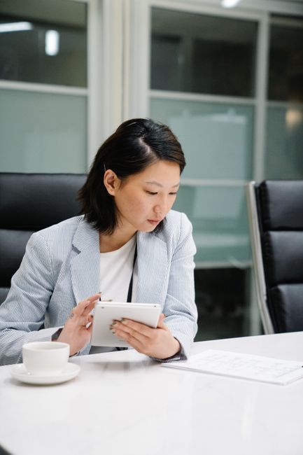 Woman reviewing hormone test results on a tablet, hormone testing guide from Hommage Women's Clinic, Gangnam, Seoul