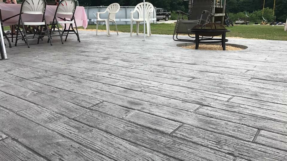 Weatherwood Plant stamped concrete patio with wood-grain texture.