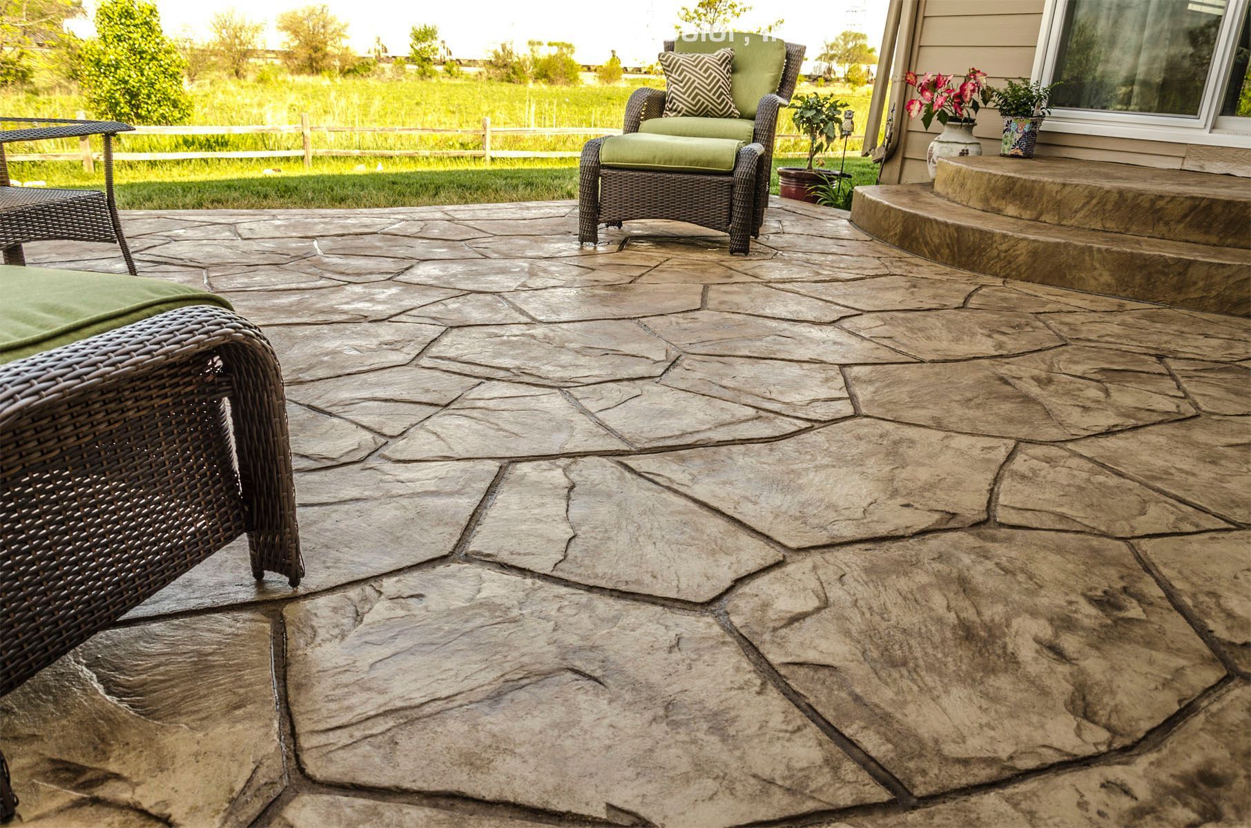 Orchard Stone stamped concrete patio with irregular flagstone shapes and natural texture.