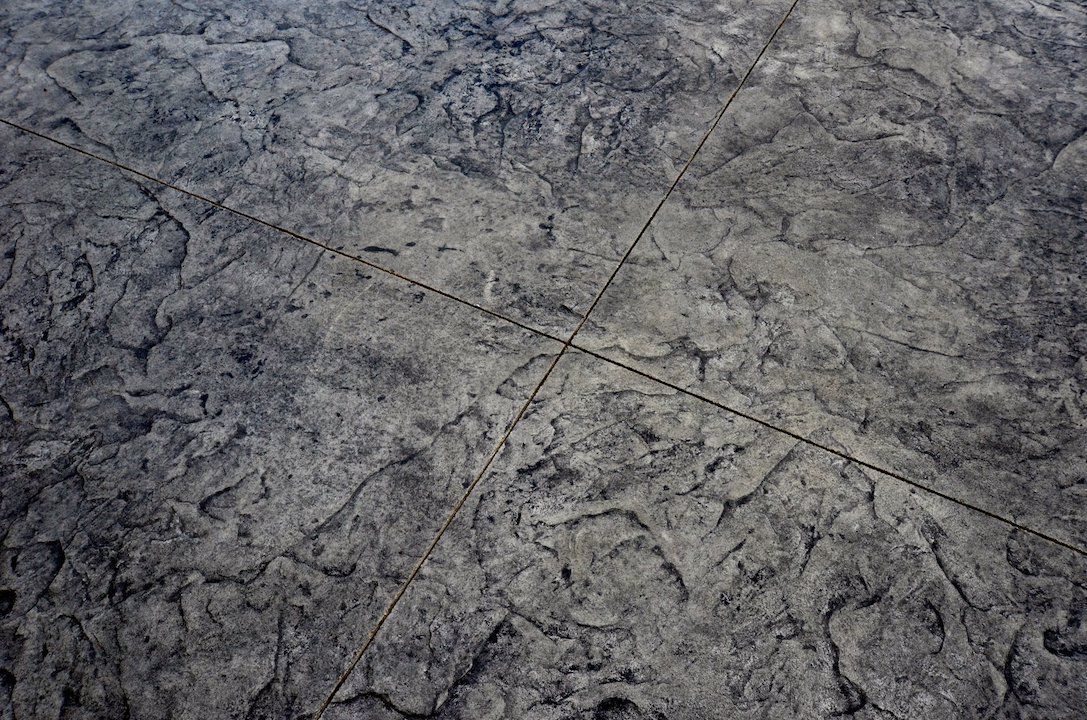 Monster Slate stamped concrete with a bold slate texture and natural stone appearance.