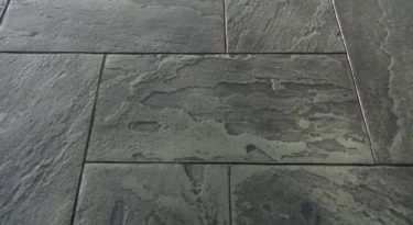 Bluestone stamped concrete with realistic stone texture and rectangular pattern.