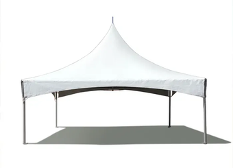 A white high-peak tent set up on a grass lawn, containing several round tables and white folding chairs.