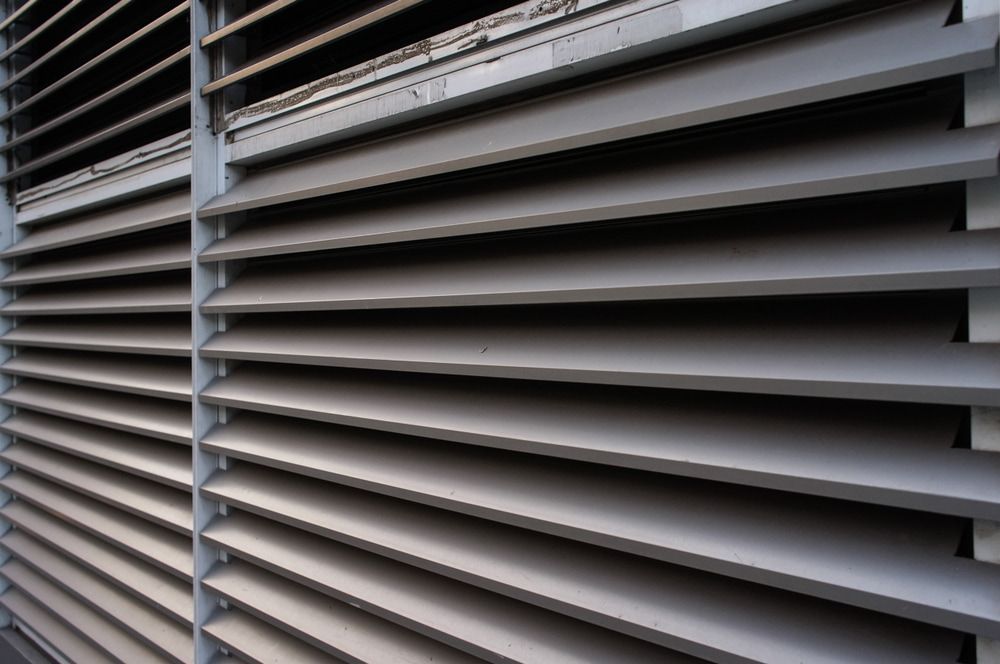 Slatted Ventilation Grilles, Gray, Provide Airflow Through an Industrial Structure — A & B Lattice World & Patios in Bungalow, QLD