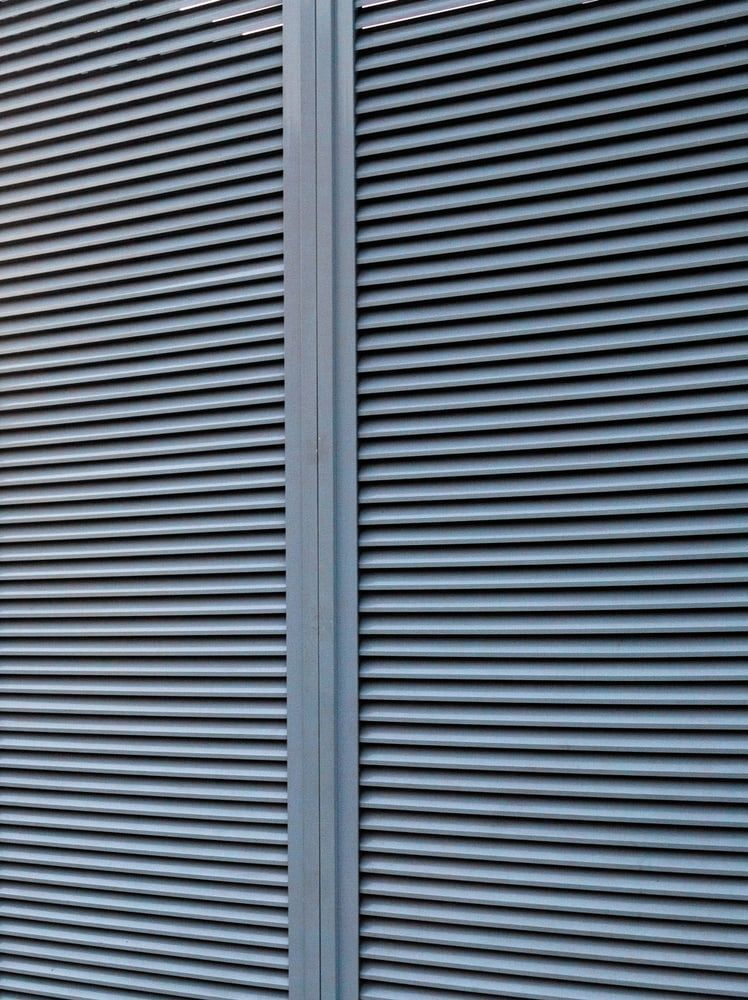 Gray Metal Louvres With Horizontal Slats — A & B Lattice World & Patios In Douglas Shire, QLD