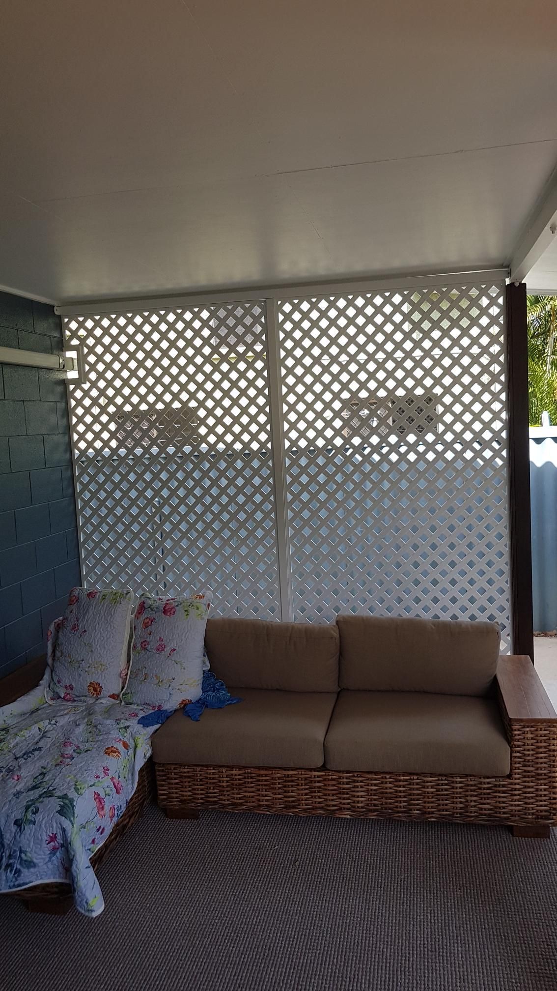 A Window with A Fence Around It Is on A White Wall — A & B Lattice World & Patios in Bungalow, QLD