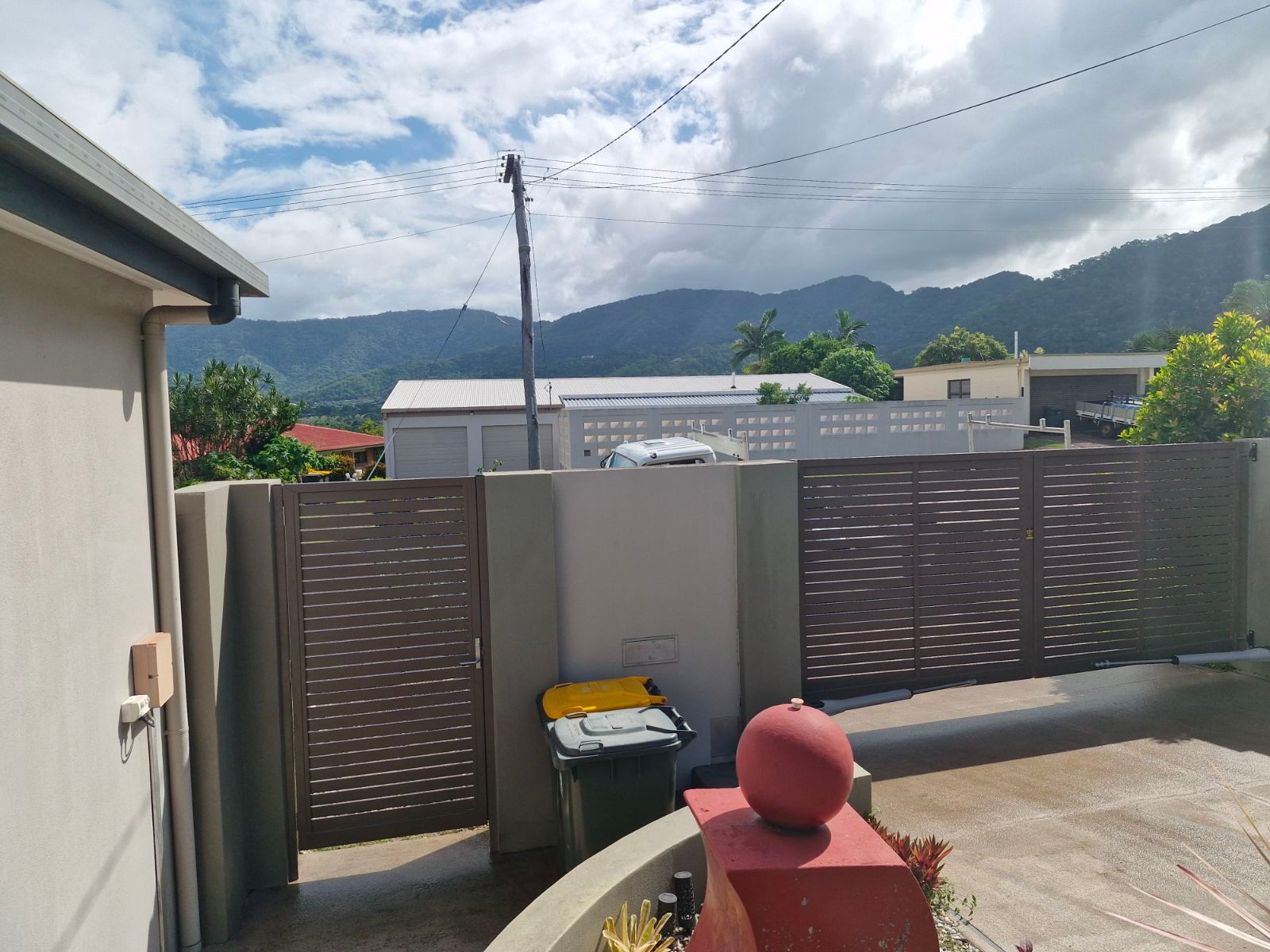 A Building with A Fence in Front of It and A Sliding Glass Door — A & B Lattice World & Patios in Bungalow, QLD
