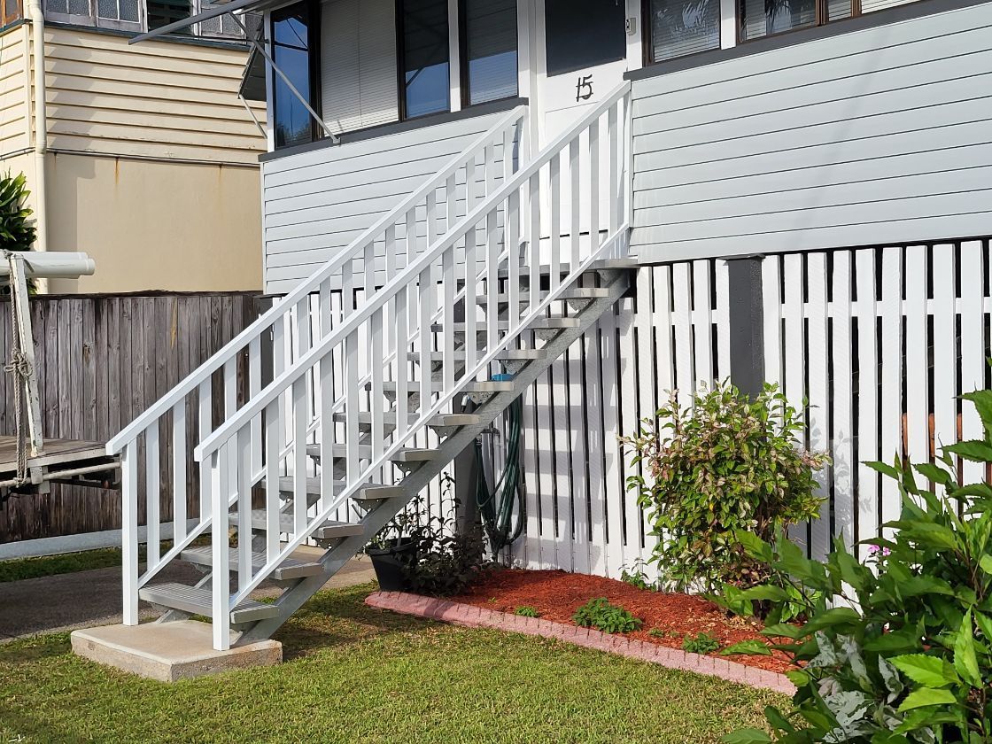 A White Aluminium Staircase Handrail — A & B Lattice World & Patios in Bungalow, QLD