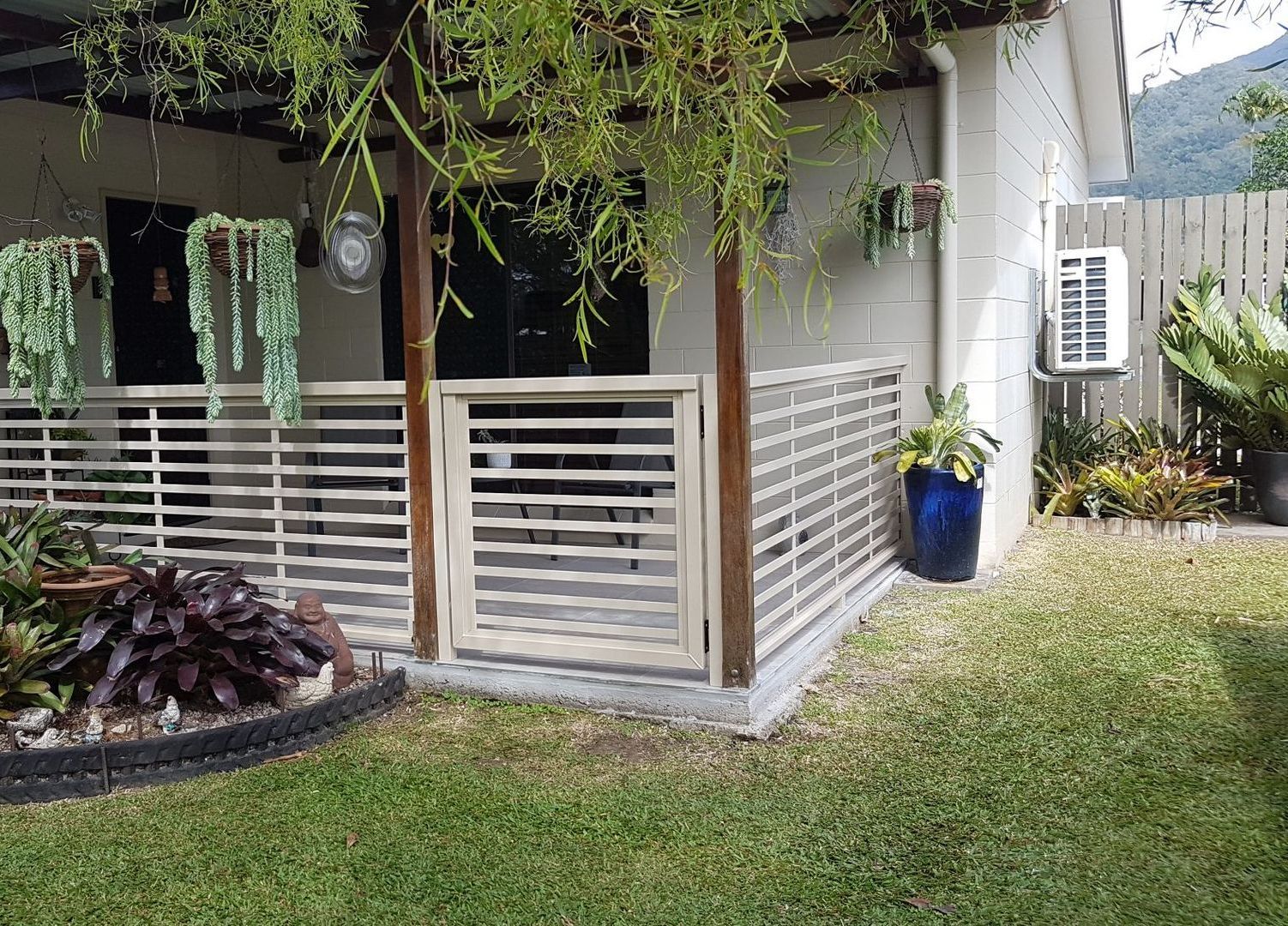 A Wooden Deck with Chairs — A & B Lattice World & Patios in Bungalow, QLD