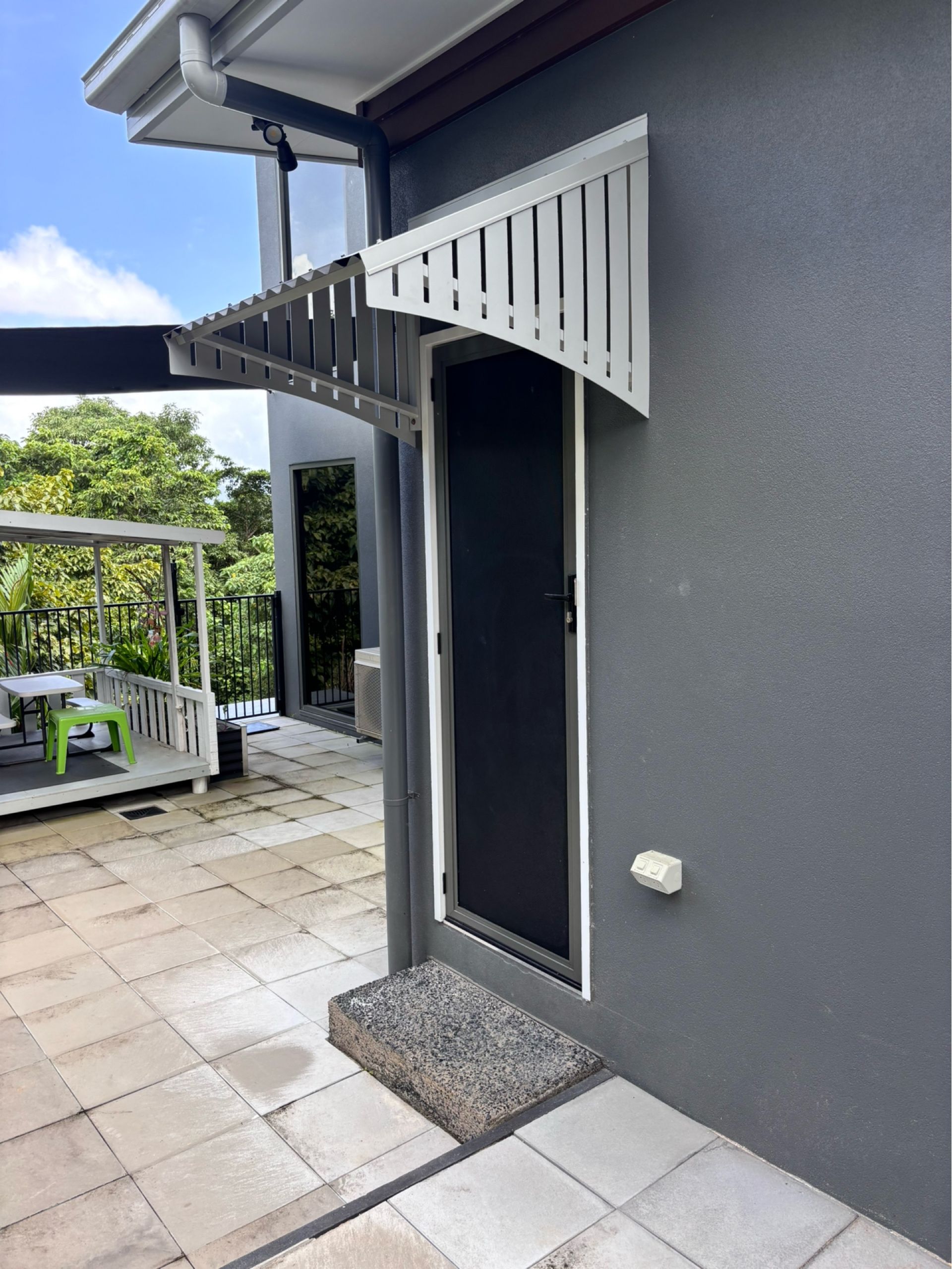 A Window with A White Decorative Awning Over It — A & B Lattice World & Patios in Bungalow, QLD