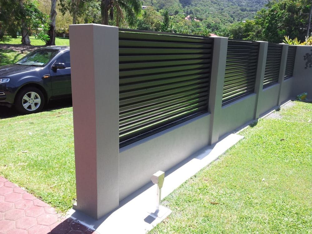 A Black Car Is Parked in Front of A Fence — A & B Lattice World & Patios in Northern Beaches, QLD