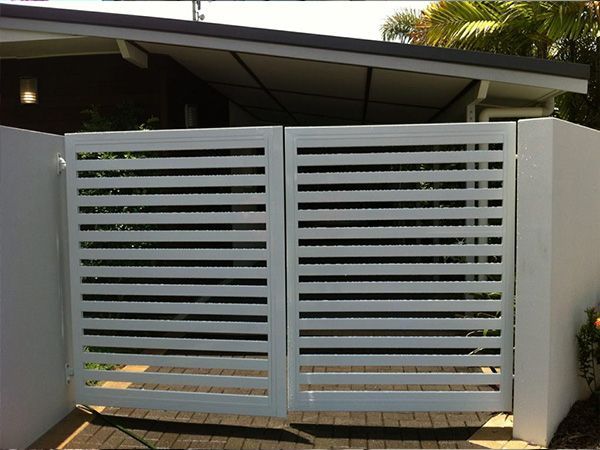 A White Gate Is Sitting in Front of A House — A & B Lattice World & Patios in Northern Beaches, QLD