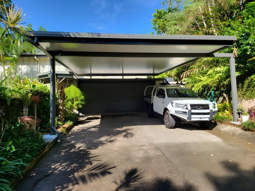 White Truck Parked Under a Carport With a Gray Roof and a Gray Garage — A & B Lattice World & Patios In Douglas Shire, QLD 