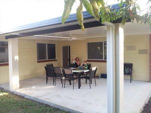 A Patio with A Table and Chairs Under a Roof — A & B Lattice World & Patios in Bungalow, QLD