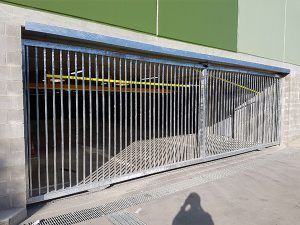 A Sliding Gate Is Open to A Parking Garage  — A & B Lattice World & Patios in Bungalow, QLD