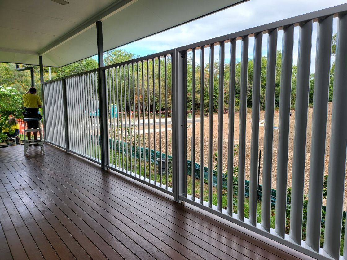 A Close up Of a Pair of White Louvres on A Window — A & B Lattice World & Patios in Bungalow, QLD