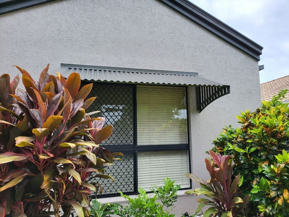 A House With a Window and a Canopy Over It — A & B Lattice World & Patios In Douglas Shire, QLD
