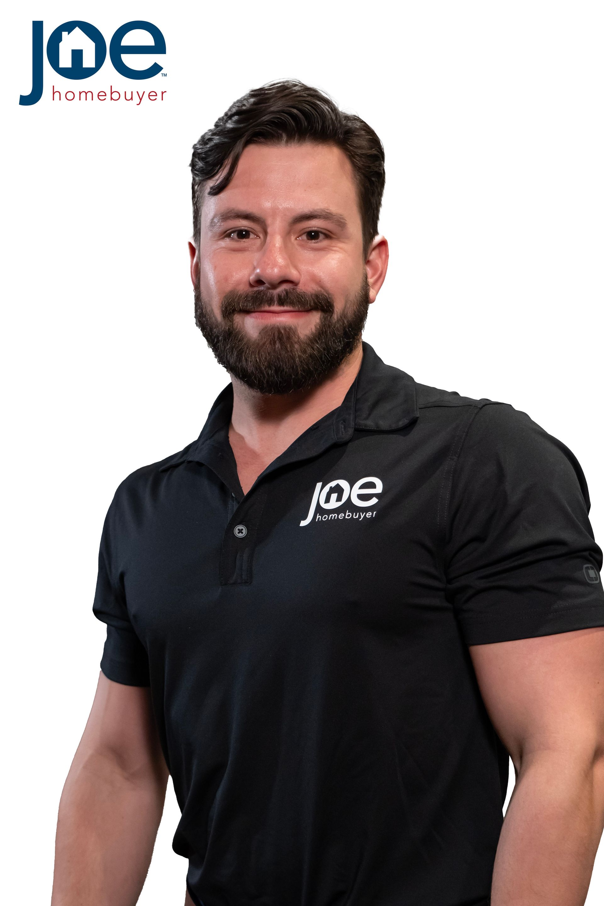 A smiling, bearded person in a black polo shirt featuring the