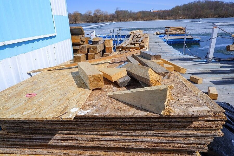 a pile of wood sitting on top of a wooden dock