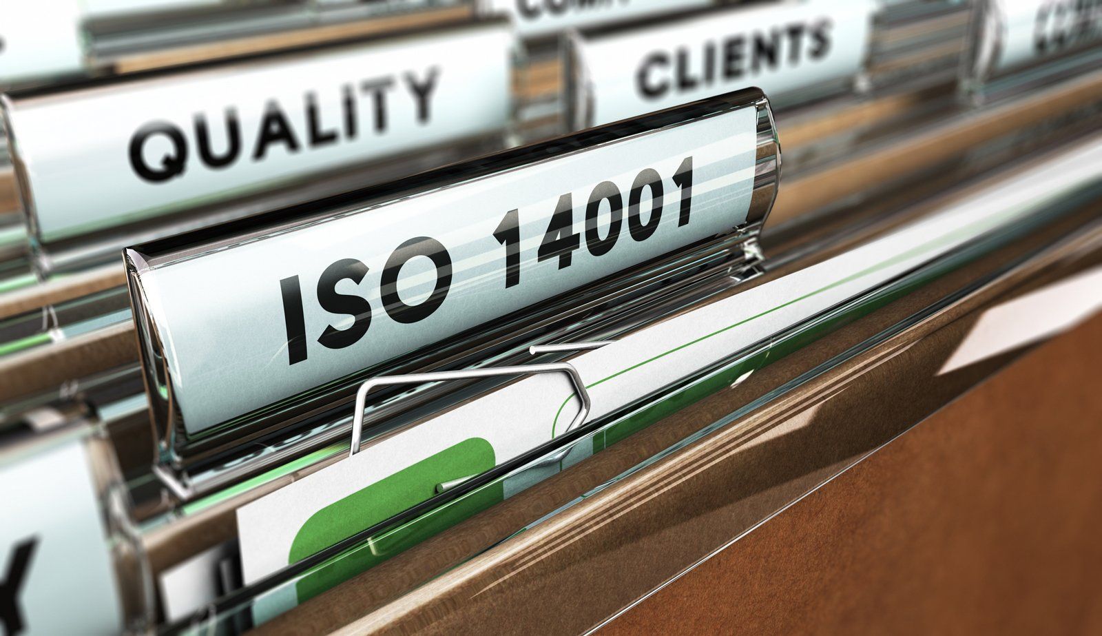 A close up of a folder with iso 14001 written on it.